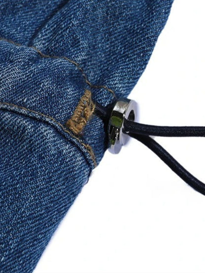 Close-up of denim fabric and stitching with zipper detail