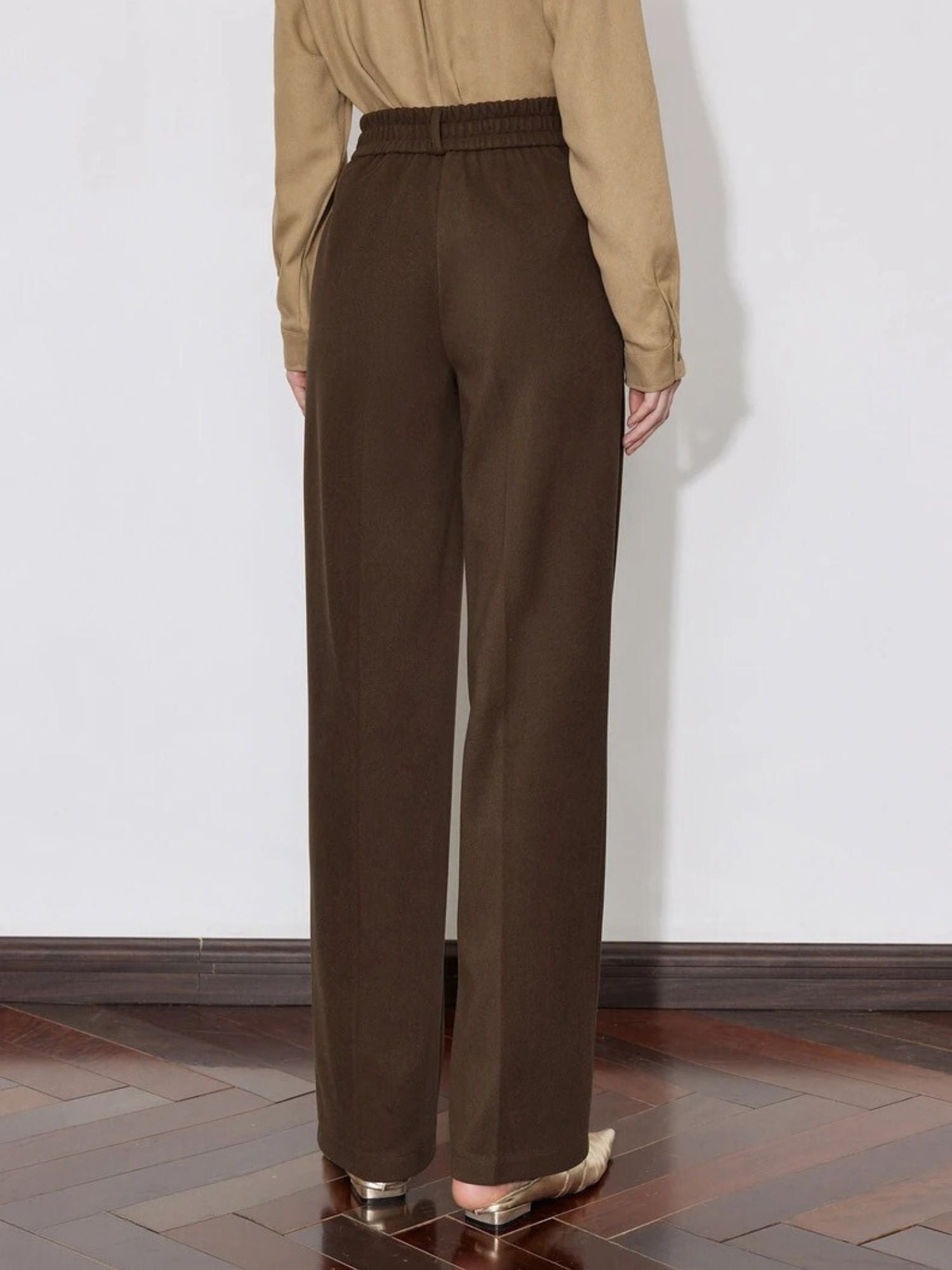 Back view of brown wide-leg trousers with straight cut