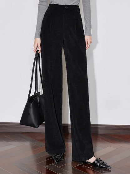 Close-up front view of black wide-leg trousers paired with a grey top