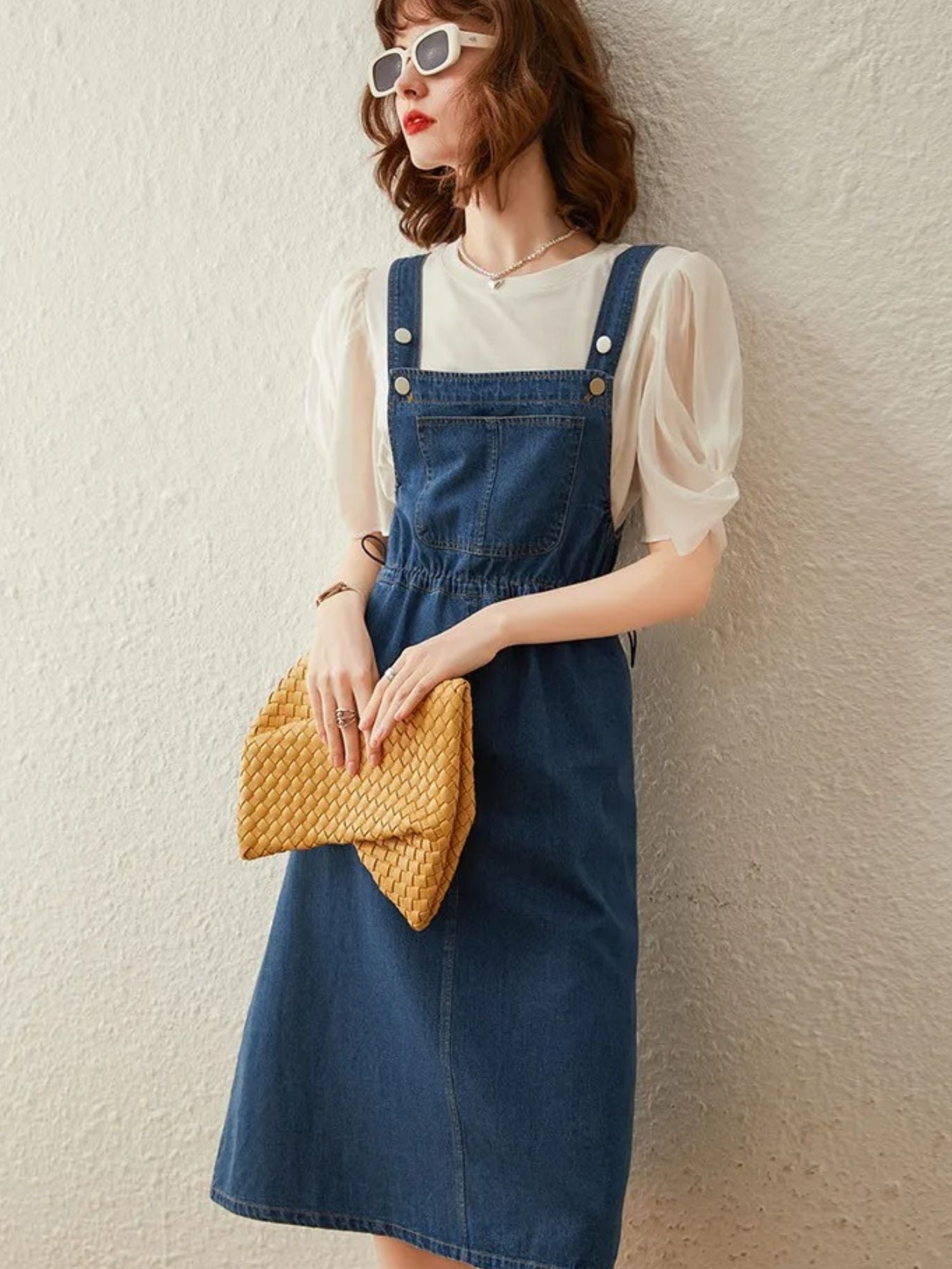 Side view of denim overall dress outfit