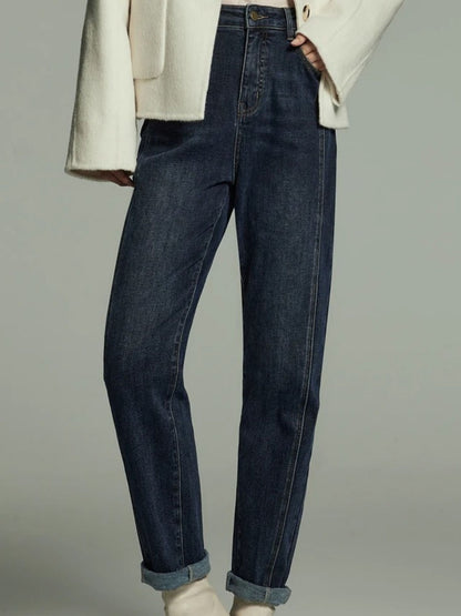 Angled front view of dark wash straight-leg jeans with cuffed hem