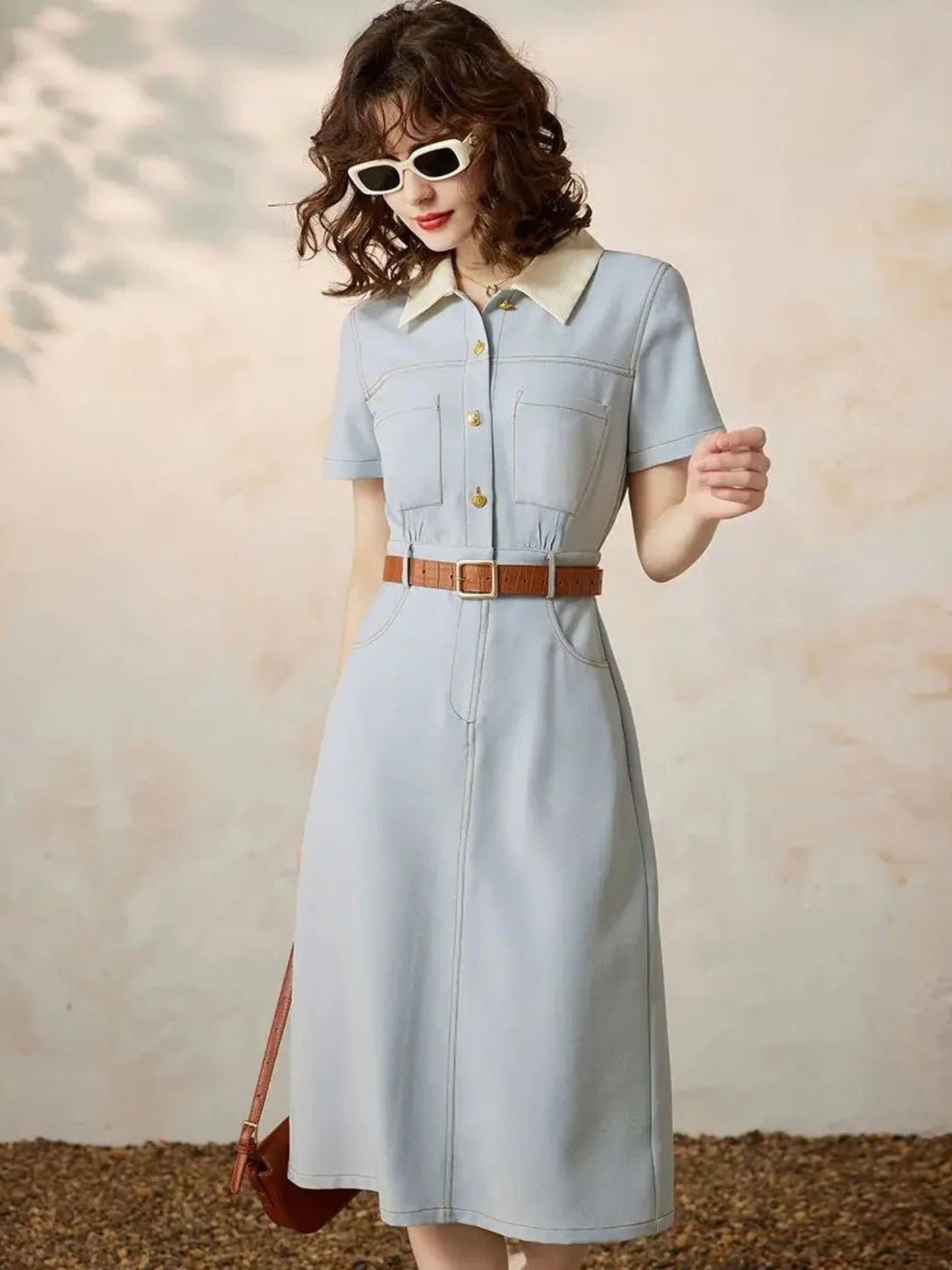 Full-body front view of dress styled with sunglasses and bag