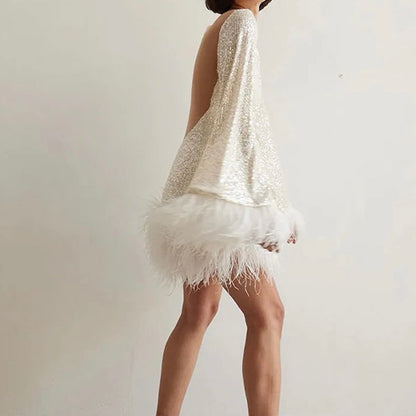 Sylis | Glamorous dress with sequins and feather hem