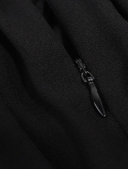 Close-up detail of black dress zipper on the back