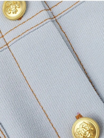 Close-up of fabric texture showing stitching and gold buttons