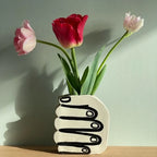 Hand Holding Flowers Vase